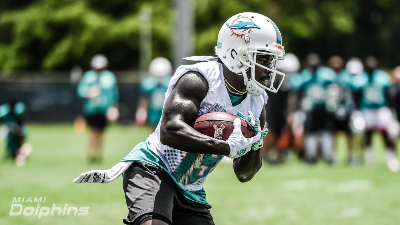 DeVante Parker of the Miami Dolphins runs a drill during practice at