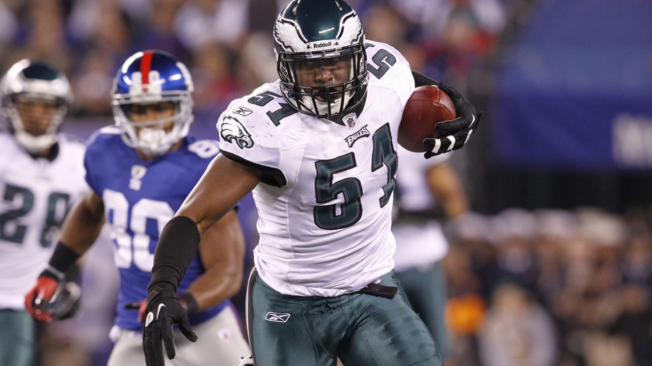 Philadelphia Eagles Asante Samuel walks off the field at the end of the  game carrying the game ball and the one he intercepted durning fourth  quarter Philadelphia Eagles-Indianapolis Colts game action in