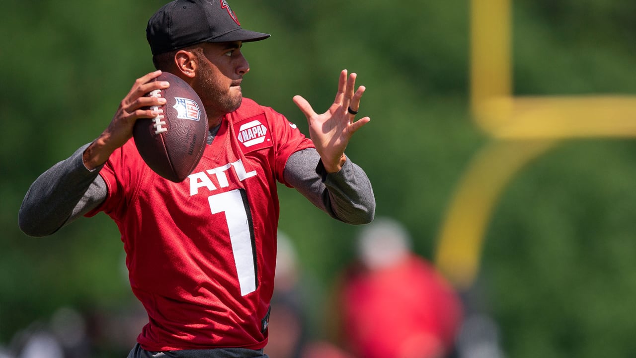 First look: Atlanta Falcons newly signed quarterback Marcus Mariota holding  his Falcons jersey, speaking with media