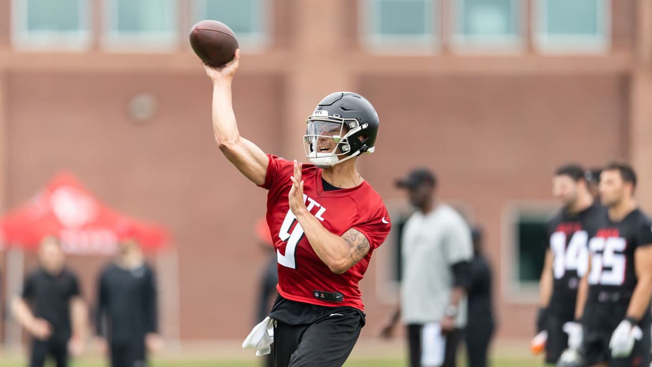 Atlanta Falcons first round draft pick wide receiver Drake London runs  after catching a pass from quarterback Desmond Ridder during their NFL  rookie minicamp football practice Friday, May 13, 2022, in Flowery