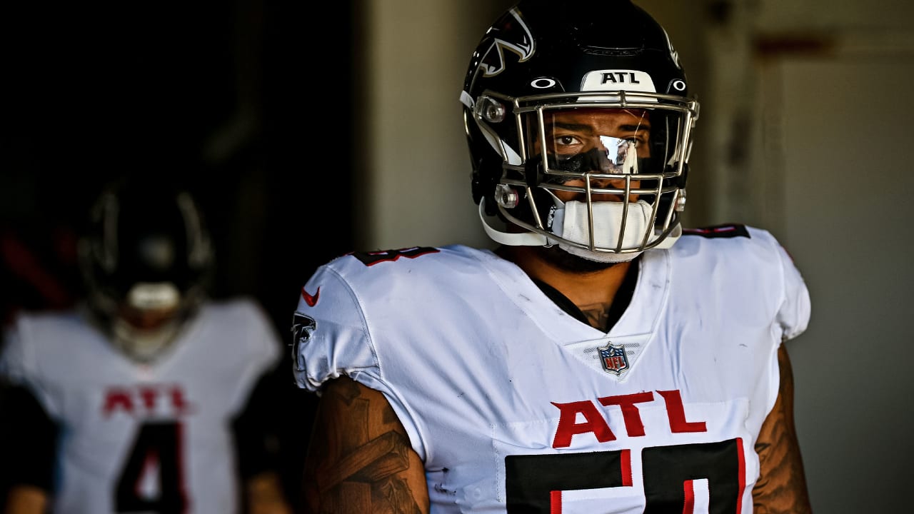 Atlanta Falcons guard Ryan Neuzil (64) works during the first half of an  NFL football game