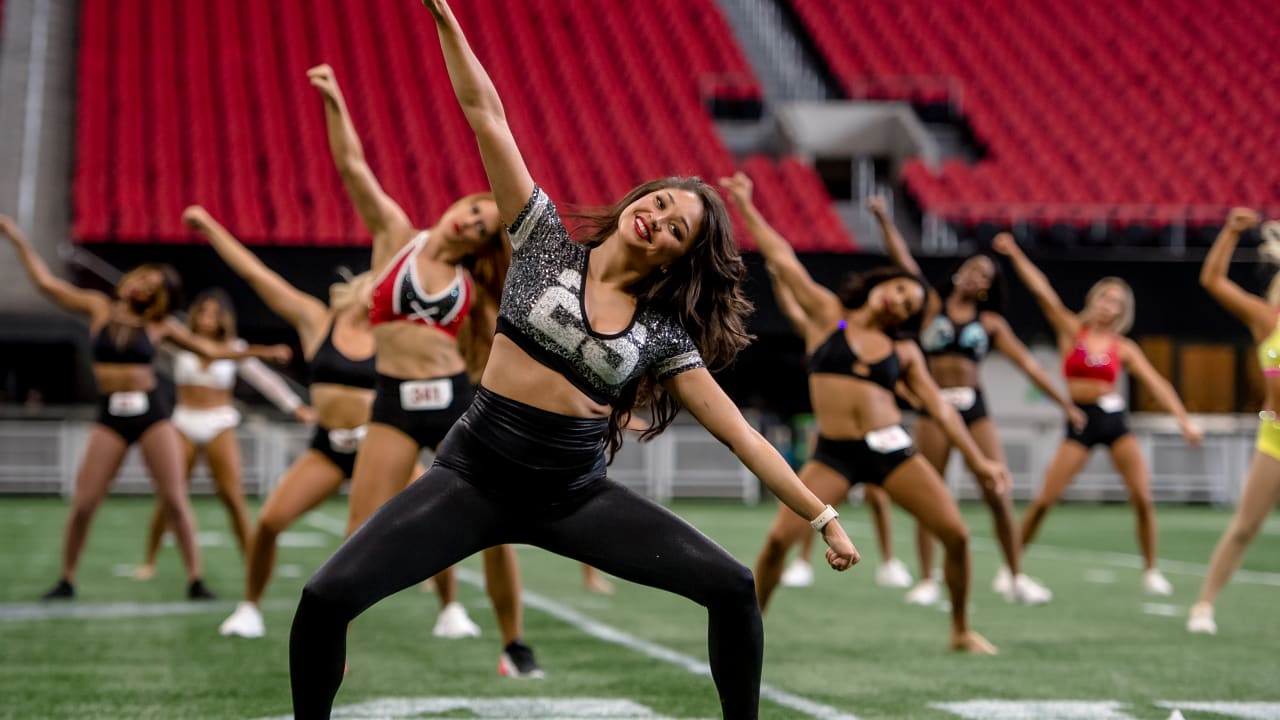 An Arizona Cardinals cheerleader performs a routine during the