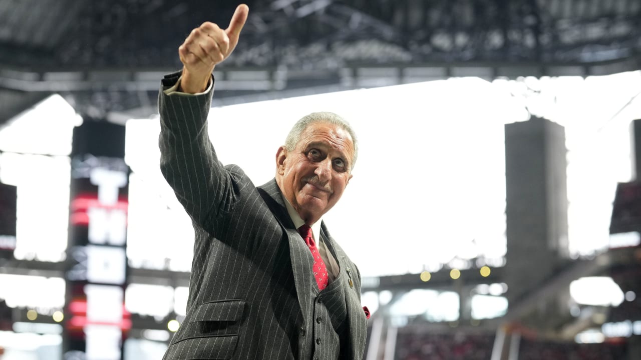 Atlanta Falcons owner Arthur Blank walks on the practice as the