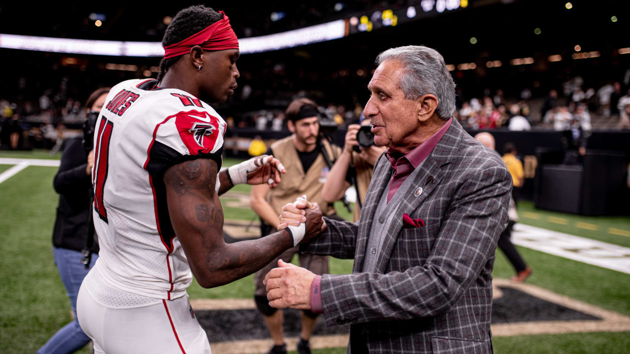 Arthur Blank greets Julio Jones during pre-game.