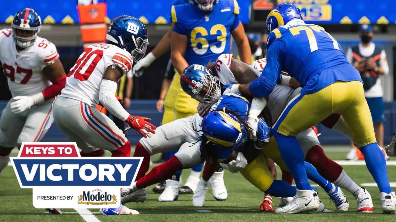 Rams' running back John Cappelletti, the former Heisman winner, is dragged  down by a shirt tackle as he tried to circle the New York Giants' left side  in Los Angeles Sunday, Sept.