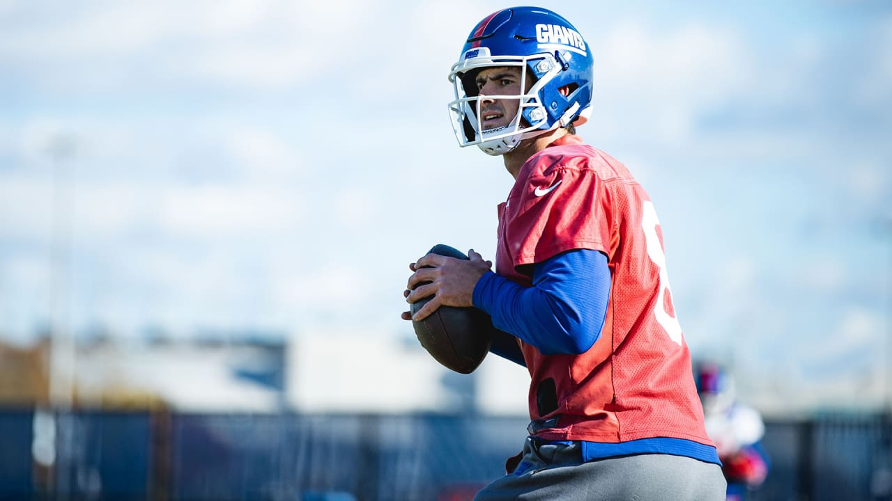 Teammates tip their helmets to Daniel Jones