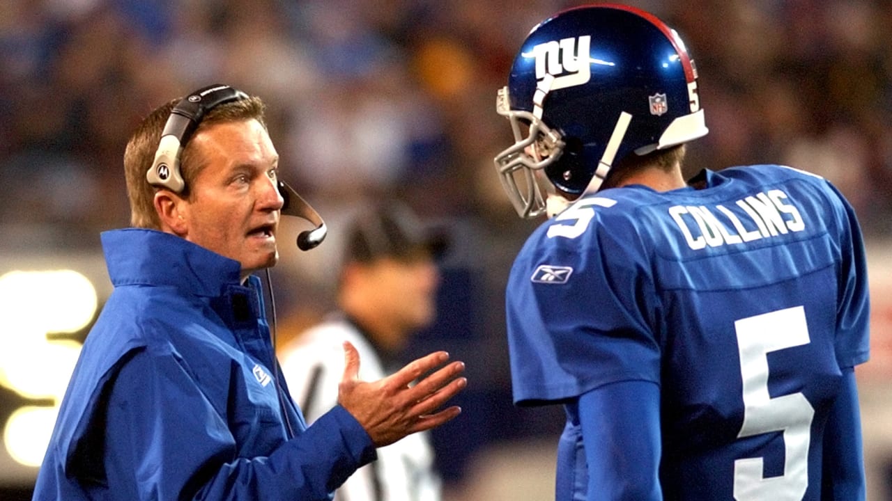 New York Giants head coach Jim Fassel, who turned 48 years-old, has a  bucket of Gatorade dumped on him by quarterback Dave Brown in celebration  of their 31-17 win over the Philadelphia