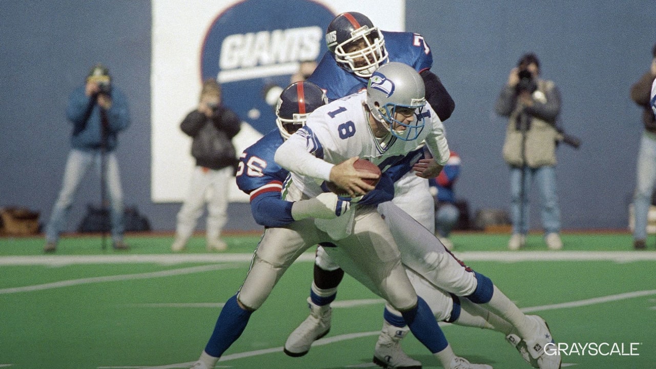 Seattle Seahawks wide receiver Deion Branch is tackled by New York Giants  safety Jason Bell after Branch made a catch in the first quarter of a NFL  football game Sunday, Sept. 24