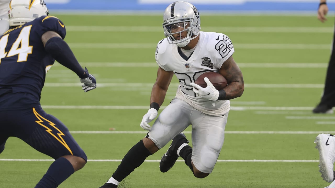 Seattle Seahawks running back Chris Carson (32) rushes against the  Cleveland Browns defensive back Jermaine Whitehead (35) during the second  half of an NFL football game, Sunday, Oct. 13, 2019, in Cleveland. (