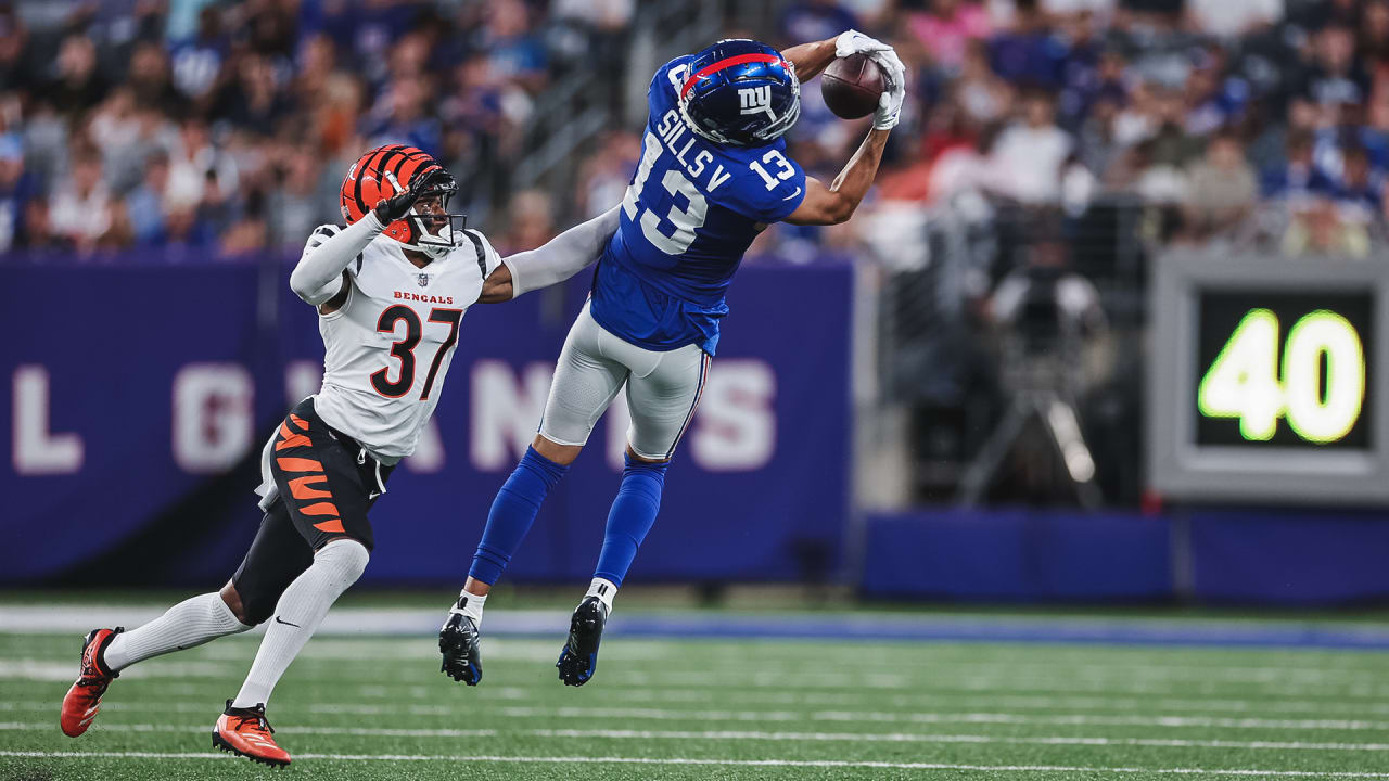 New York Giants wide receiver Collin Johnson (15) runs toward Cincinnati  Bengals' Tre Flowers (33) during the first half of a preseason NFL football  game Sunday, Aug. 21, 2022, in East Rutherford