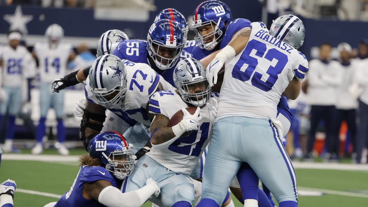 Dallas Cowboys' and Denver Broncos' kickers and other special-teams  players warm up prior to a National Football League game at the Cowboys'  home field AT&T Stadium in Arlington, Texas