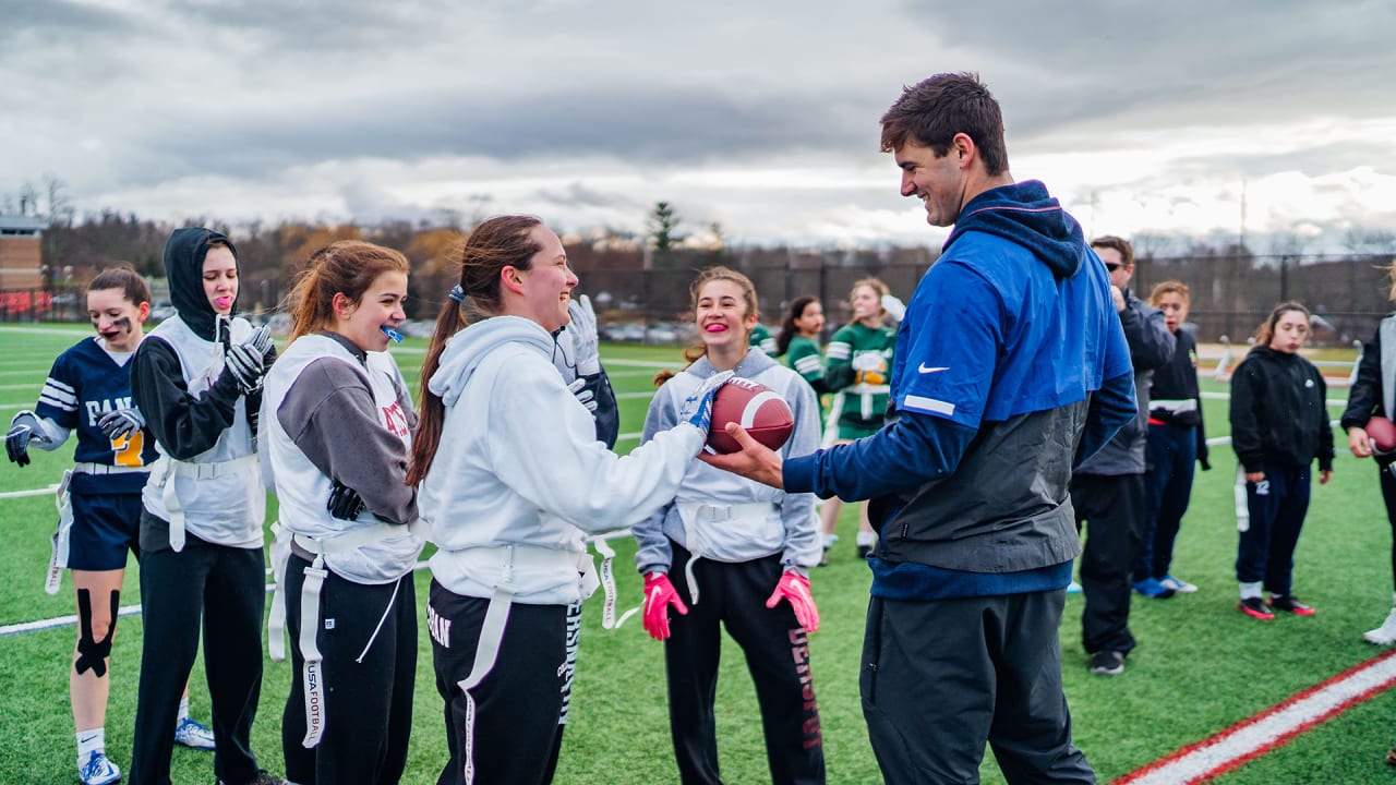 Giants QB Daniel Jones helps to kickoff girls flag football