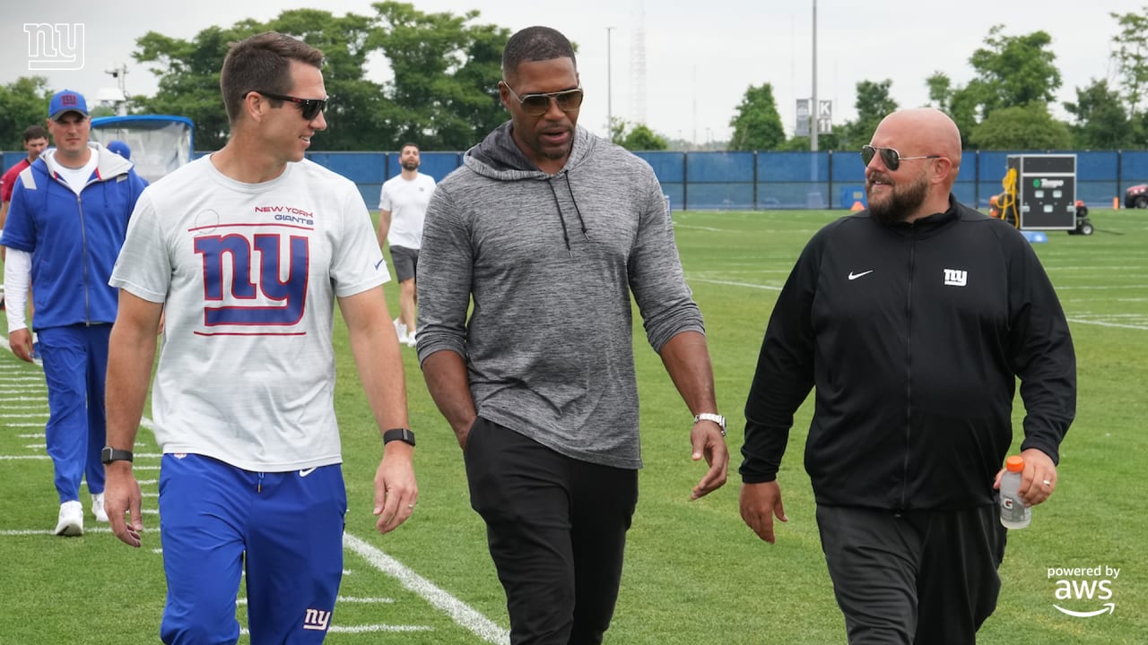 New York Giants Michael Strahan gets ready on the sidelines in the