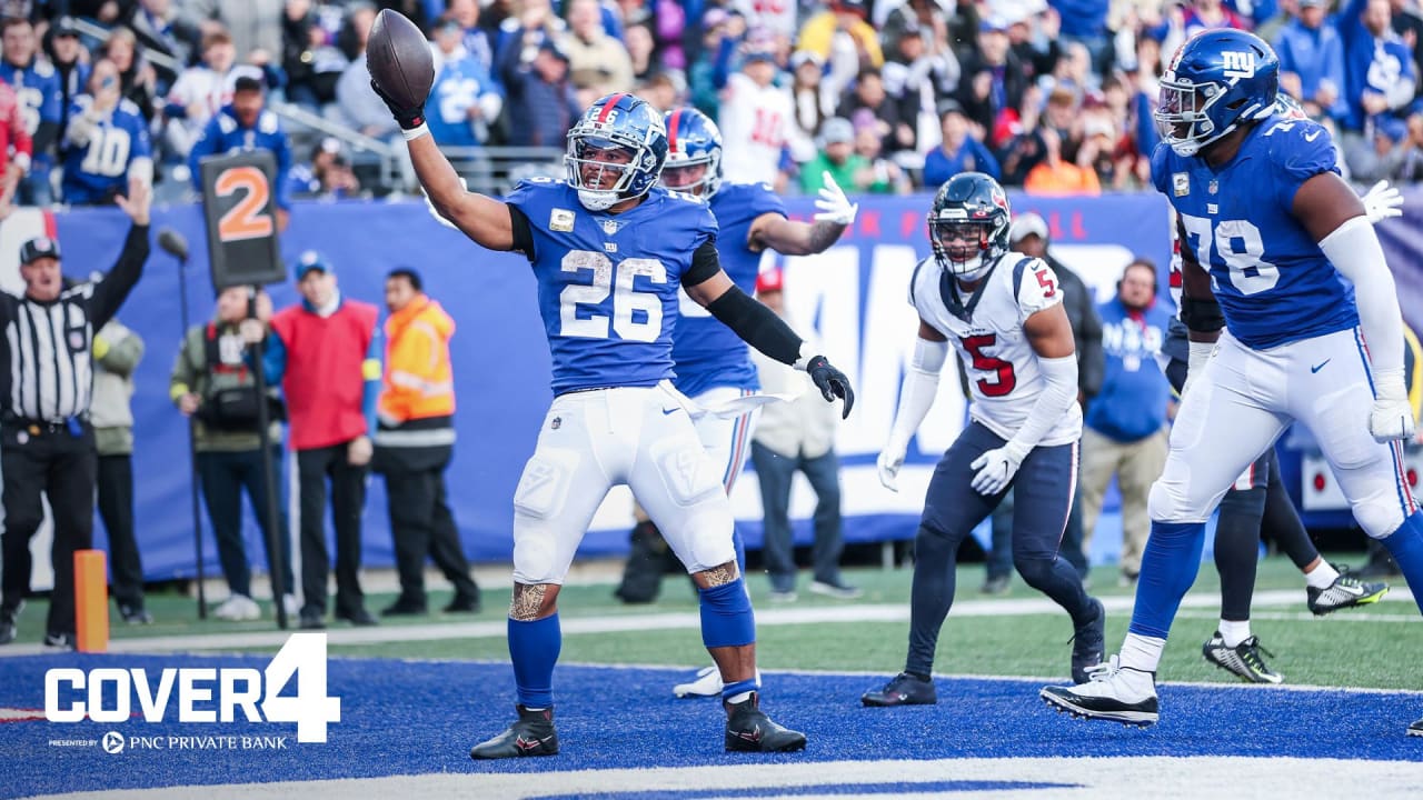 Tanner Hudson of the New York Giants is tackled by Jonathan Owens