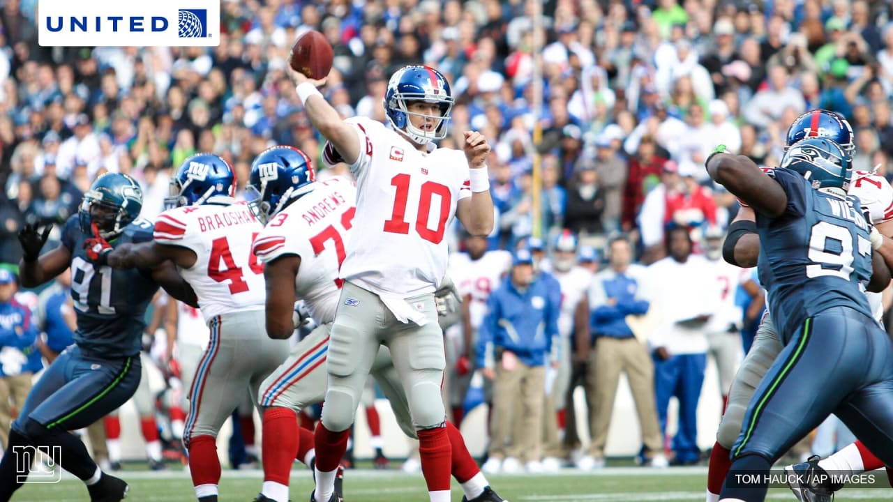 New York Giants Jake Ballard is held up by Seattle Seahawks Kam