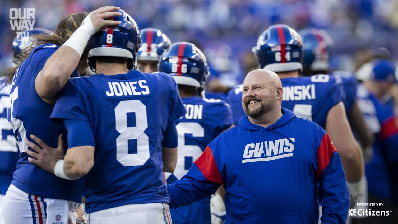 New York Giants' Isaiah Hodgins catches a pass between Minnesota Vikings'  Chandon Sullivan and Duke Shelley during the first half of an NFL wild card  football game Sunday, Jan. 15, 2023, in