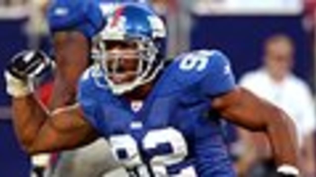 Michael Strahan stands on the field before the 2006 NFL Pro Bowl