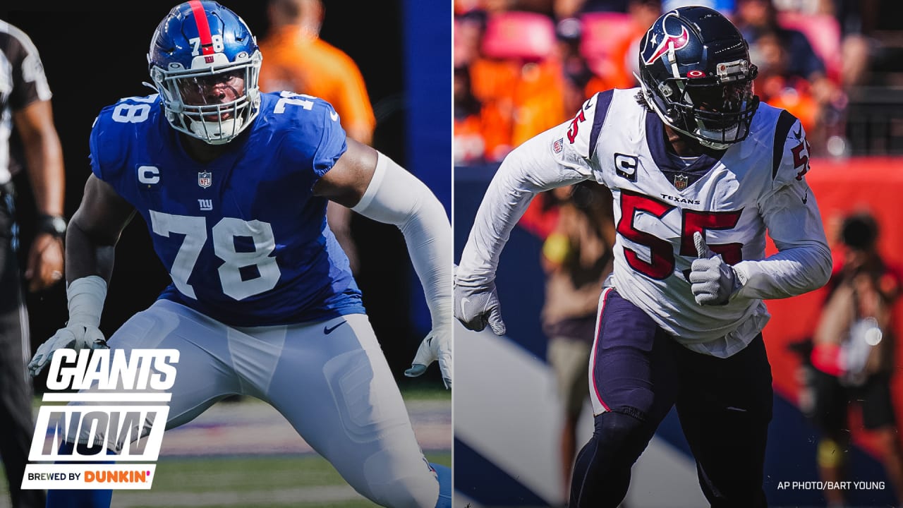 Tanner Hudson of the New York Giants is tackled by Jonathan Owens