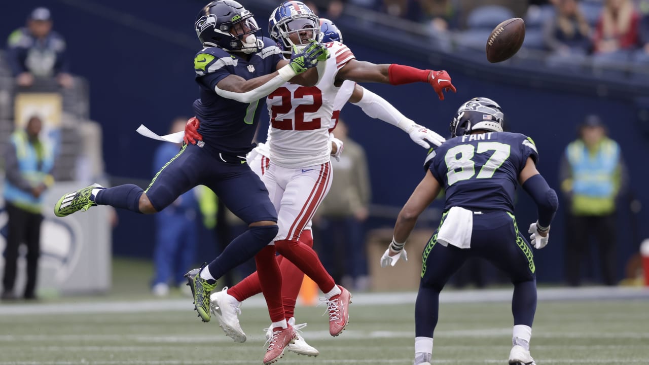 Seattle Seahawks wide receiver DK Metcalf, right, catches a pass against  New York Giants cornerback Adoree' Jackson during the first half of an NFL  football game in Seattle, Sunday, Oct. 30, 2022. (