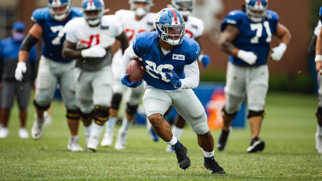 New York Giants running back Saquon Barkley (26) running with the ball  during the first half of an NFL football game, Thursday, Sept. 16, 2021, in  Landover, Md. (AP Photo/Alex Brandon Stock