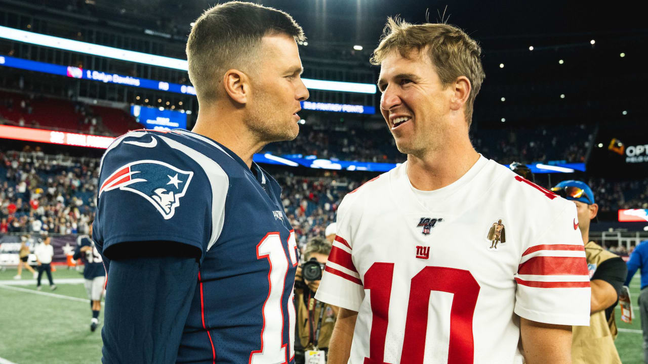 New England Patriots Tom Brady and head coach Bill Belichick smile on the  field during practice before the game against the New York Giants at Giants  Stadium in East Rutherford, New Jersey