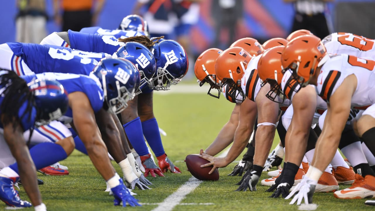 Bulldogs in the NFL - Image 34: Cleveland Browns running back Nick Chubb  (left) and his cousin Denver Broncos outside linebacker Bradley Chubb  (right) exchange jerseys following the game at Broncos Stadium