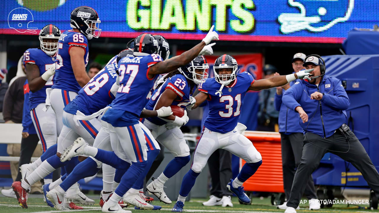 Detroit Lions defensive end Aidan Hutchinson (97) reacts after an  interception against the New York Giants during an NFL football game  Sunday, Nov. 20, 2022, in East Rutherford, N.J. (AP Photo/Adam Hunger