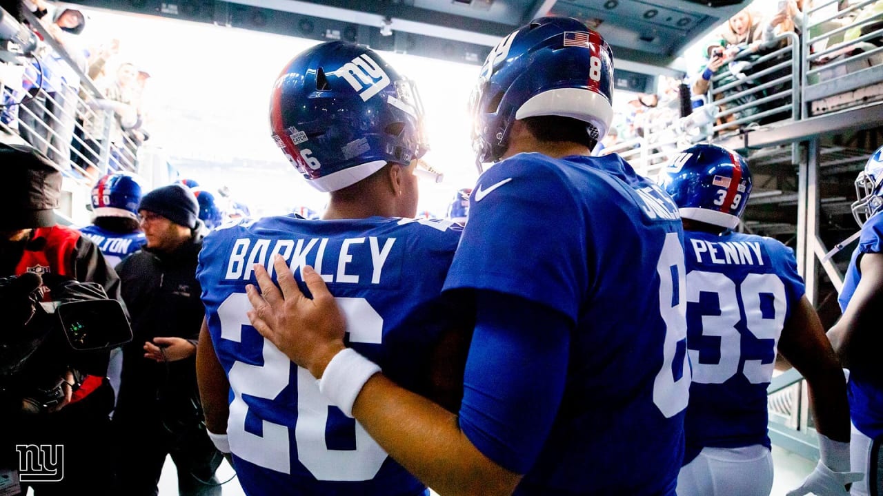 Teammates tip their helmets to Daniel Jones