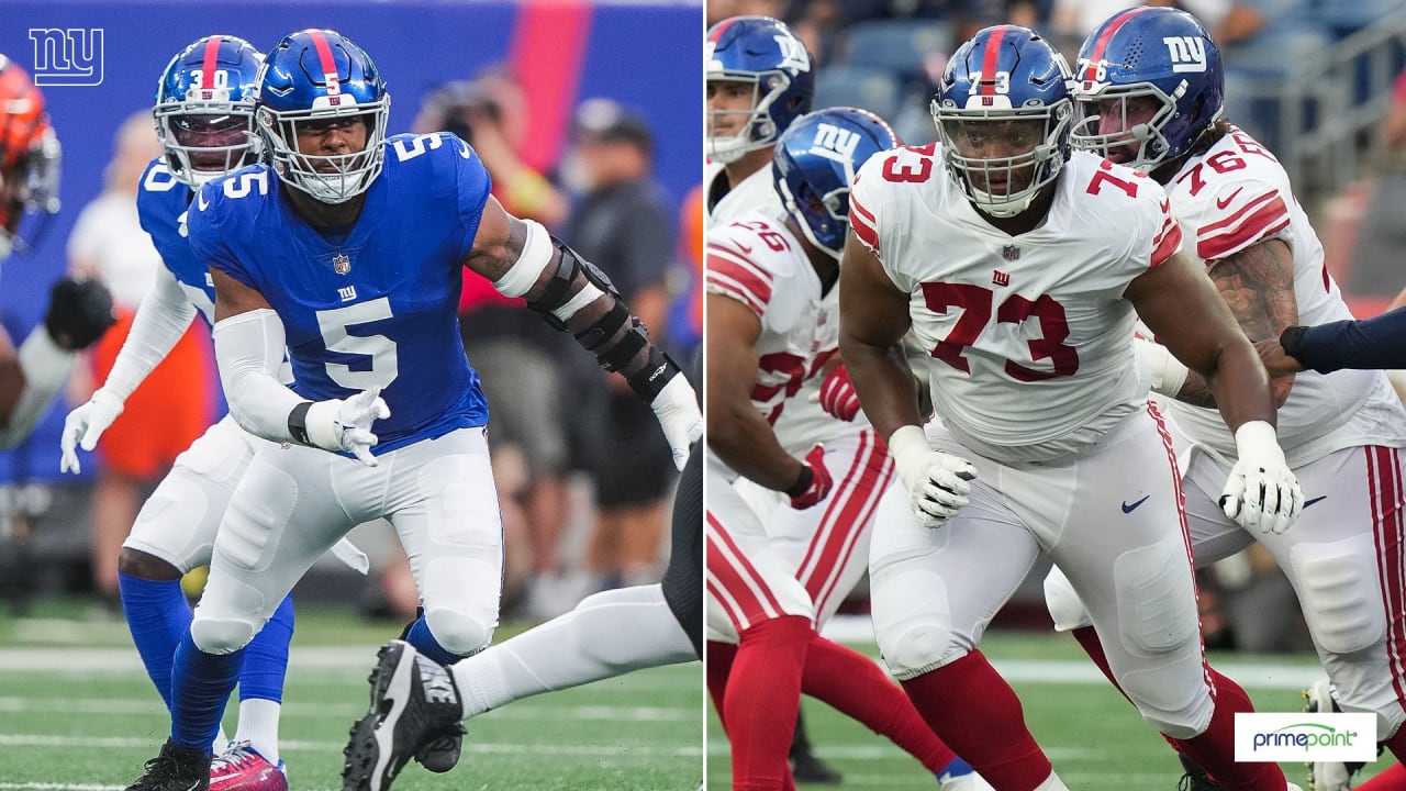 New York Giants safety Dane Belton (24) and linebacker Tomon Fox