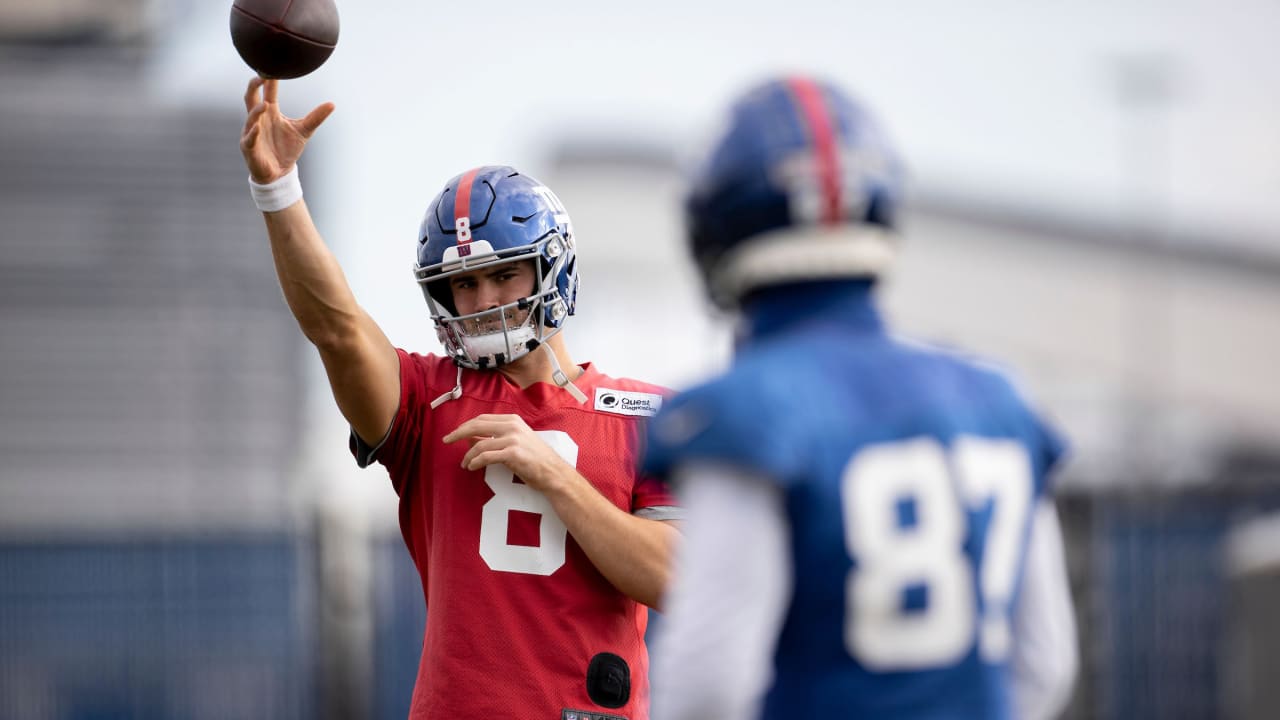 Fran Tarkenton, New York Giants quarterback, shows why he is known for his  scrambling finesse as he evades Cardinals in first quarter of game and  prepares to throw a pass in New