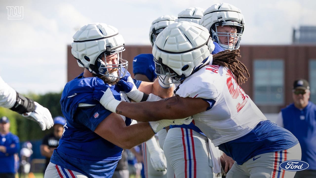 New York Giants guard Mark Glowinski (64) walks off the field