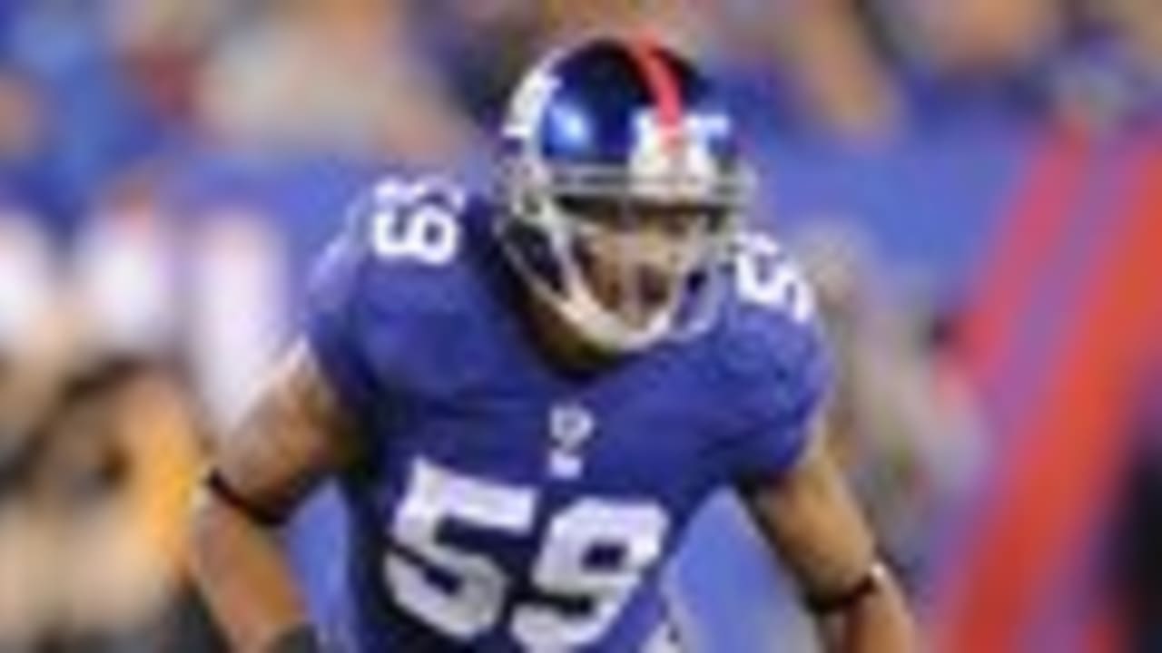 New York Giants linebacker Michael Boley (59) relays a defense adjustment  to his teammates during second half NFL action in the New York Giants'  31-18 victory over the Carolina Panthers at New