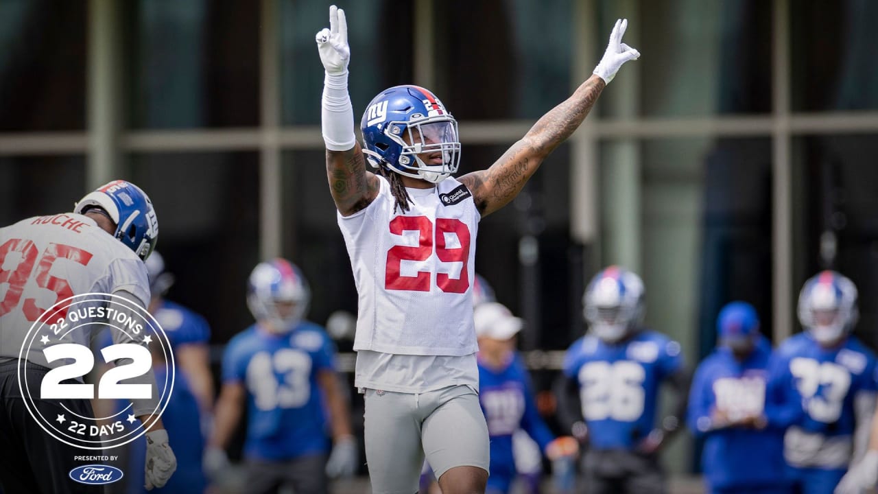 Victor Cruz back at practice, wearing protective red jersey