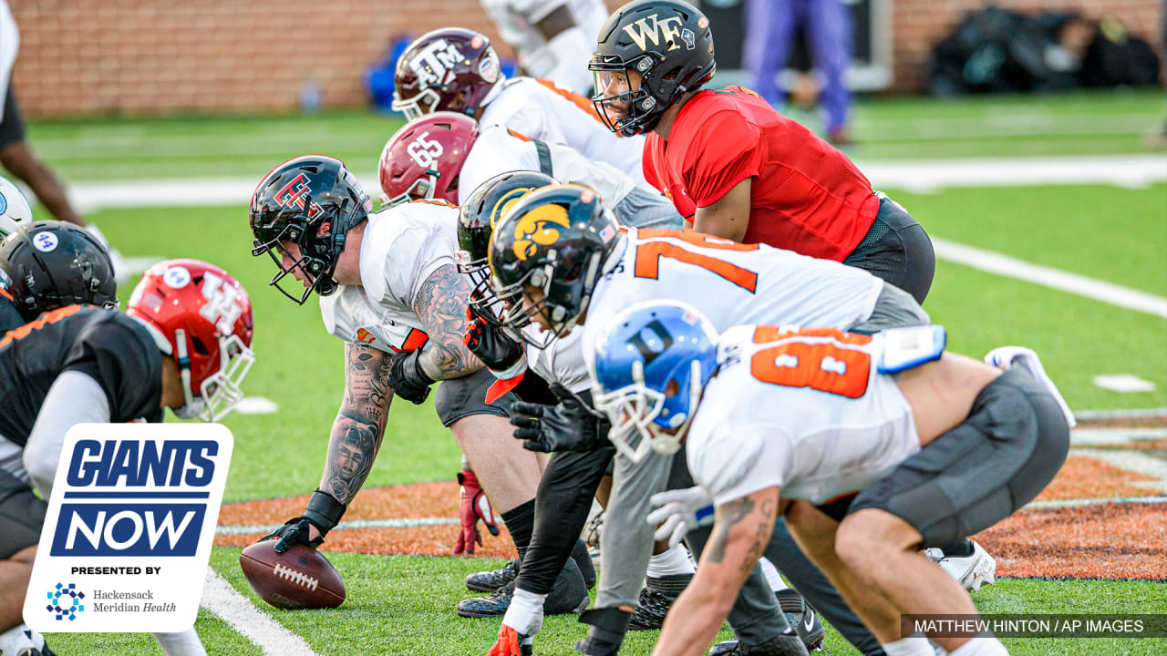 National Team defensive lineman Tarron Jackson of Coastal Carolina (99)  runs a blocking drill with offensive lineman Dillon Radunz of North Dakota  State(FCS) (75) during the National team practice for the NCAA