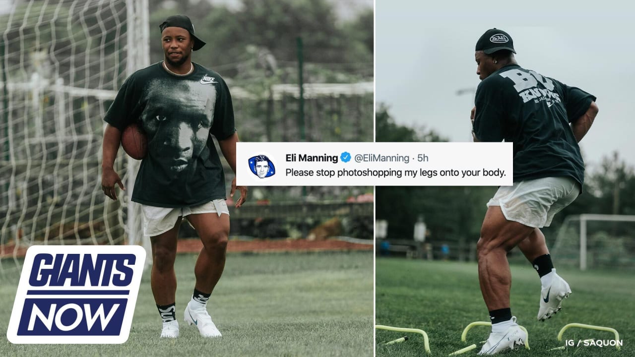 New York Giants Eli Manning stands with Saquon Barkley on the