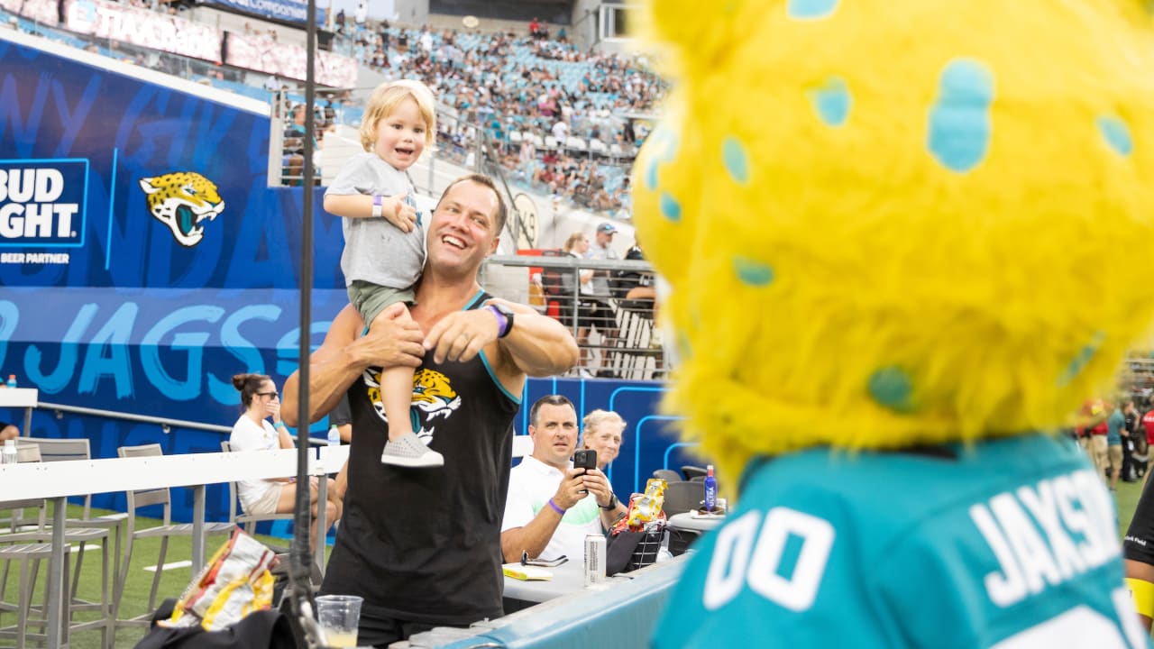 Jacksonville Jaguars fans pose for photos outside the stadium