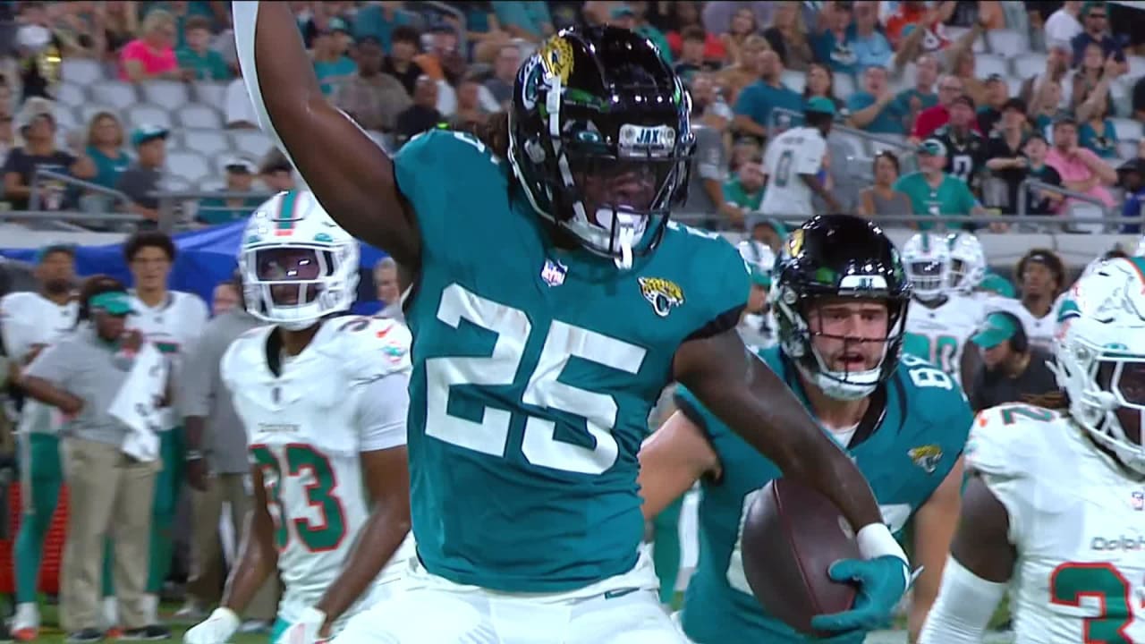 Jacksonville Jaguars running back D'Ernest Johnson (25) runs into the end  zone to score a touchdown during the first half of an NFL preseason  football game against the Miami Dolphins, Saturday, Aug.