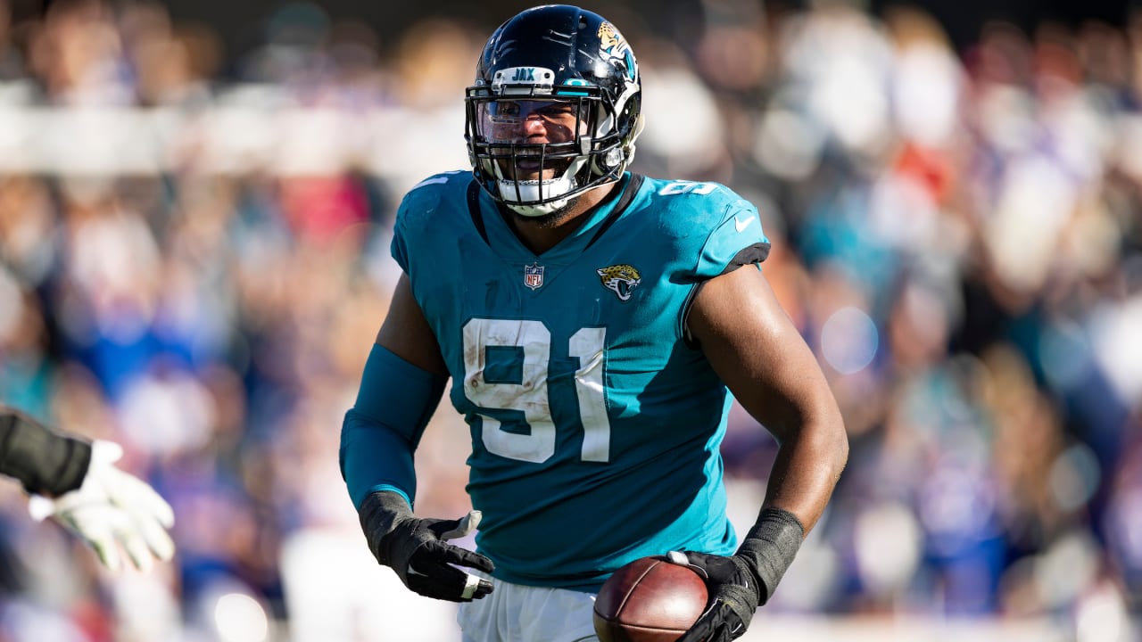 JACKSONVILLE, FL - NOVEMBER 28: Jacksonville Jaguars running back James  Robinson (25) runs with the ball during the game between the Atlanta  Falcons and the Jacksonville Jaguars on November 28, 2021 at