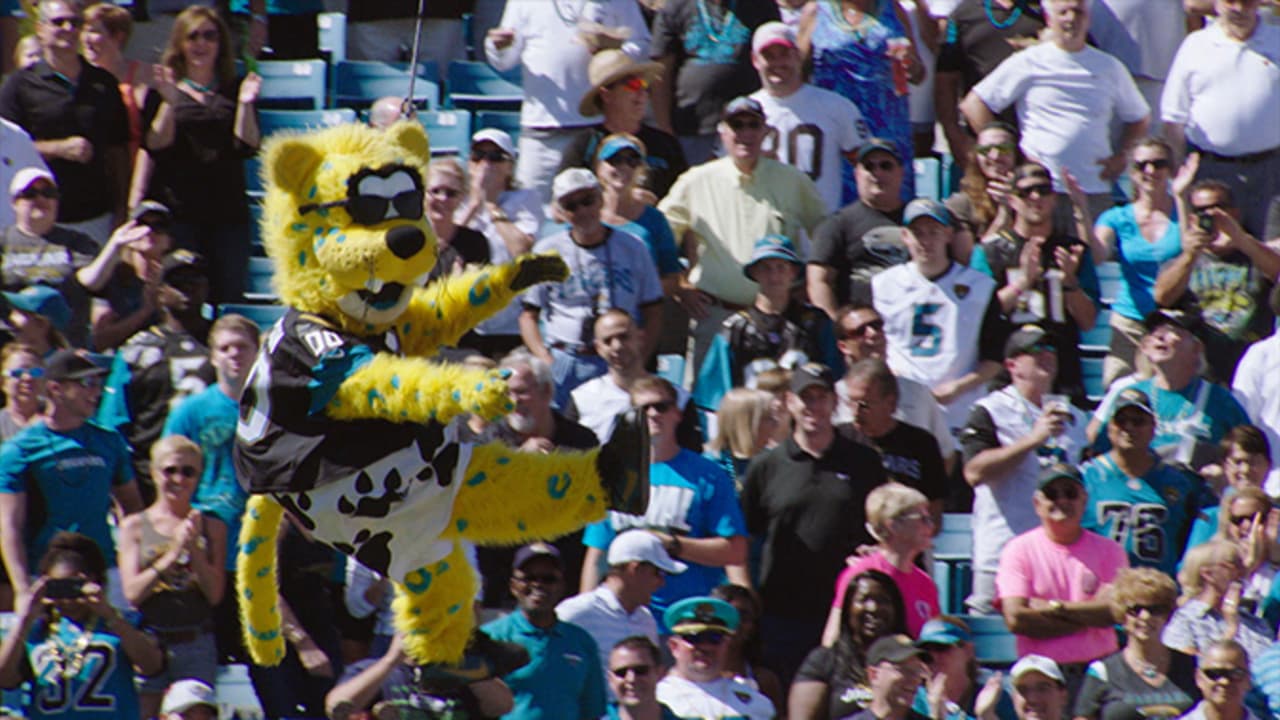 Jacksonville Jaguars mascot Jaxson De Ville holds a Buffalo Bills