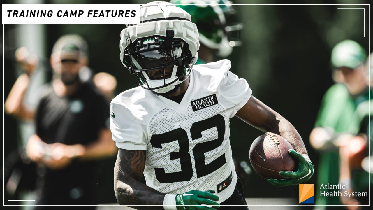 New York Jets running back Michael Carter (32) looks on against