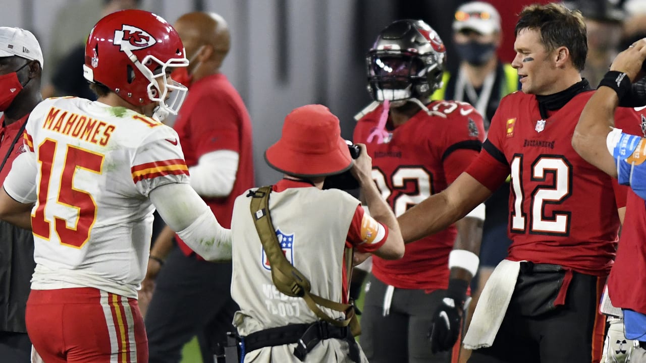 Devin White of the Tampa Bay Buccaneers stands over Travis Kelce of