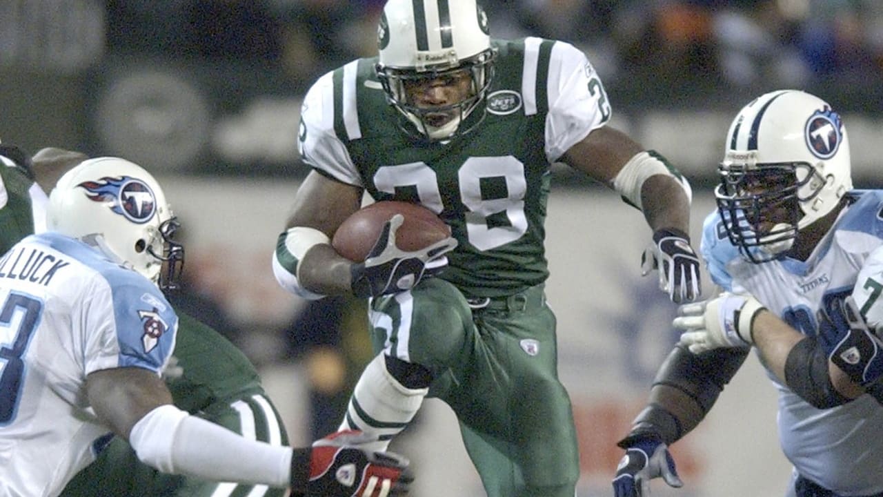 NJP2000010203 - 02 JANUARY 2000 - EAST RUTHERFORD, NEW JERSEY, USA: New  York Jets RB Curtis Martin (28) has tries to avoid the tackle of Seattle  Seahawks S Kerry Joseph (28). The