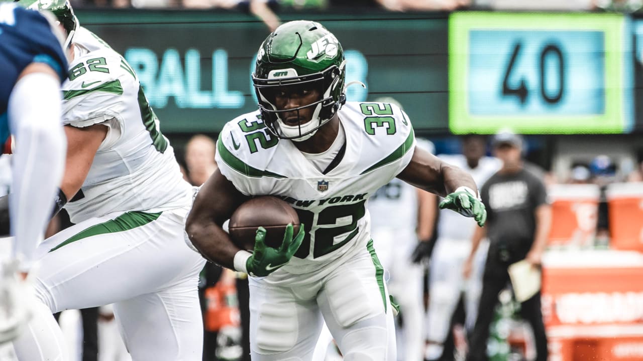 New York Jets running back Michael Carter (32) looks on against