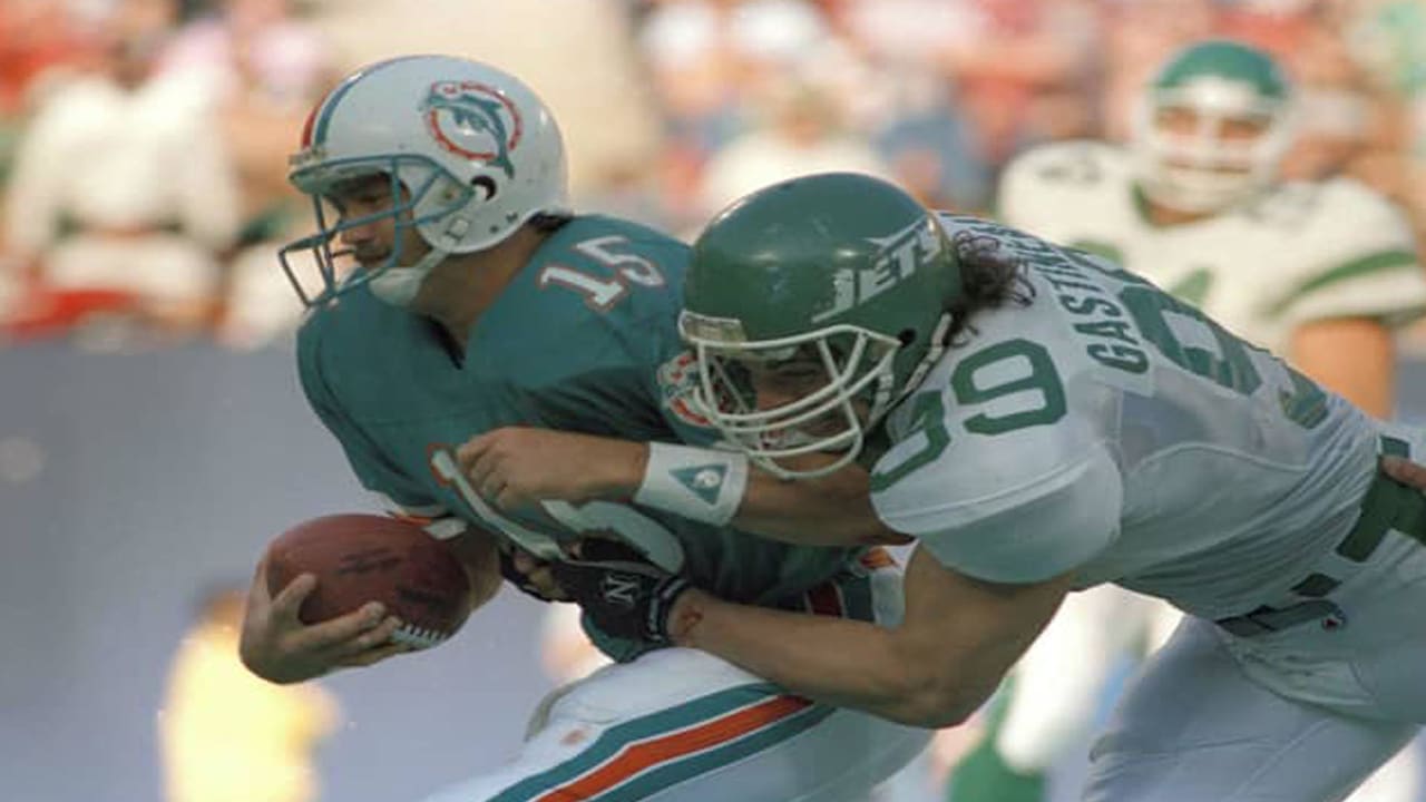 Defensive end Mark Gastineau of the New York Jets throws his hands in