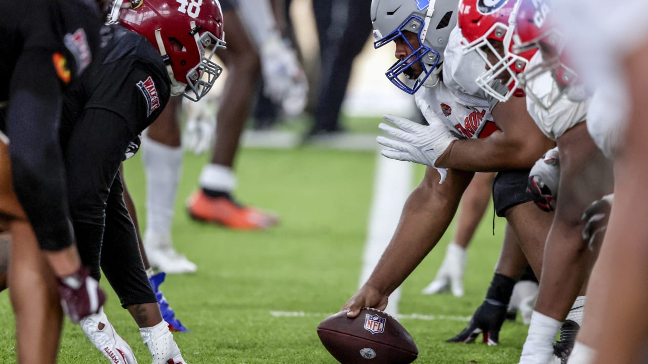 American Team defensive lineman DeAngelo Malone of Western Kentucky (10)  runs through drills during practice for