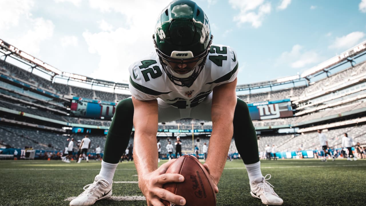 New York Jets long snapper Thomas Hennessy (42) on the sidelines during an  NFL game against the Green Bay Packers Sunday, Oct. 16, 2022, in Green Bay,  Wis. (AP Photo/Jeffrey Phelps Stock