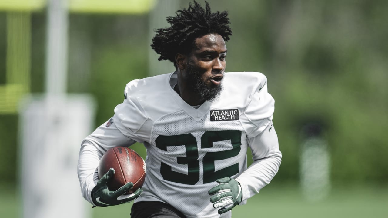 New York Jets running back Michael Carter (32) looks on against