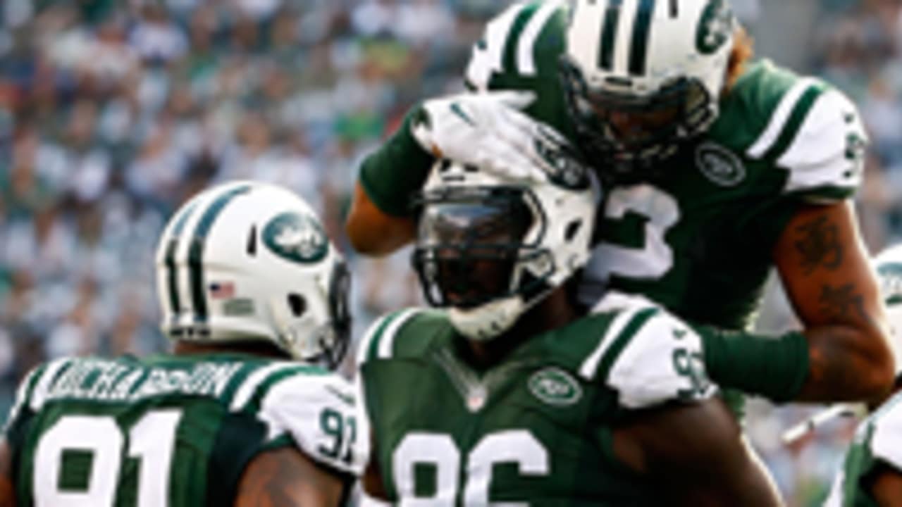 New York Jets Mike Catapano watches Muhammad Wilkerson tackle