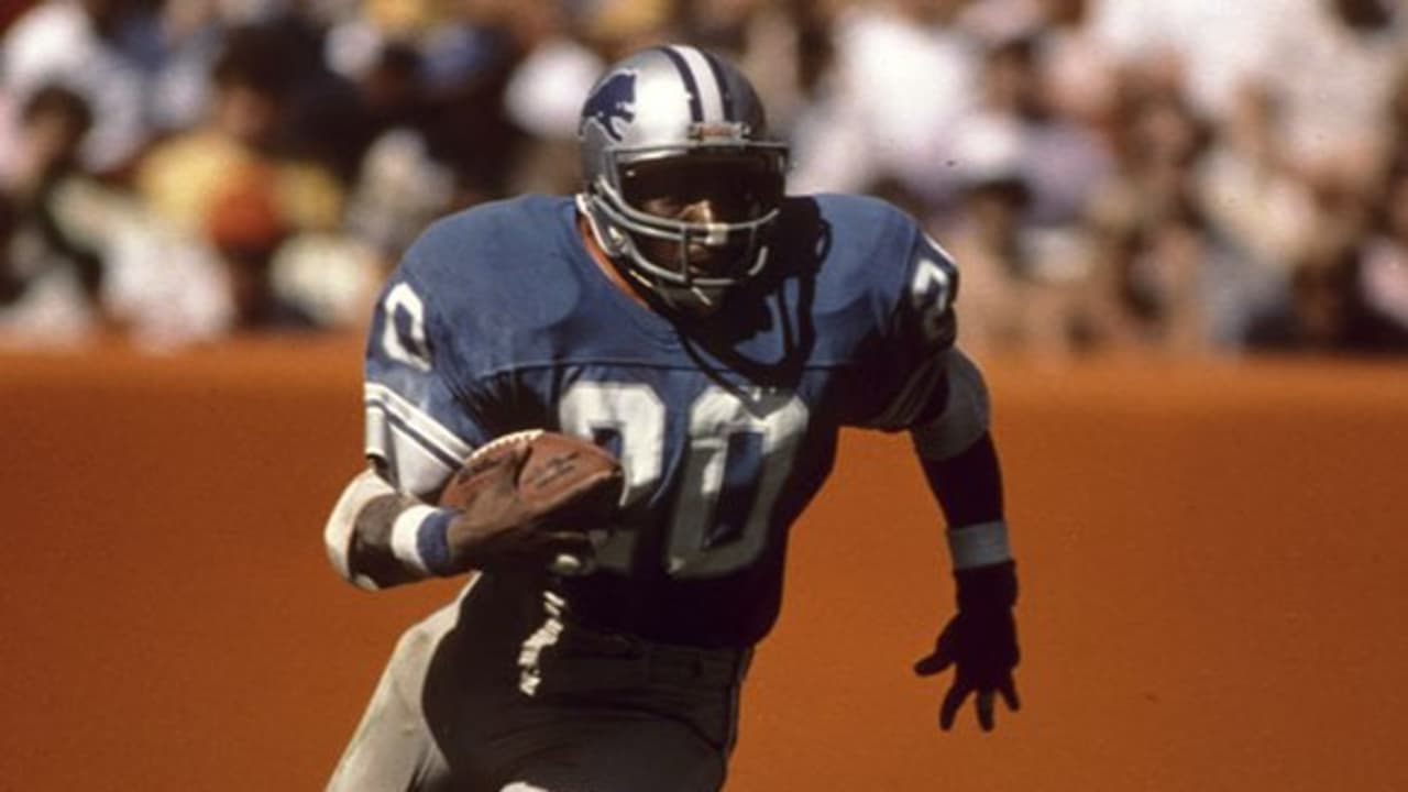 Detroit Lions running back Billy Sims (20) leaps over New Orleans Saints  tacklers in the fourth quarter on, Oct. 12, 1980 in Pontiac, Minnesota.  Simms scored on the play, and Detroit defeated