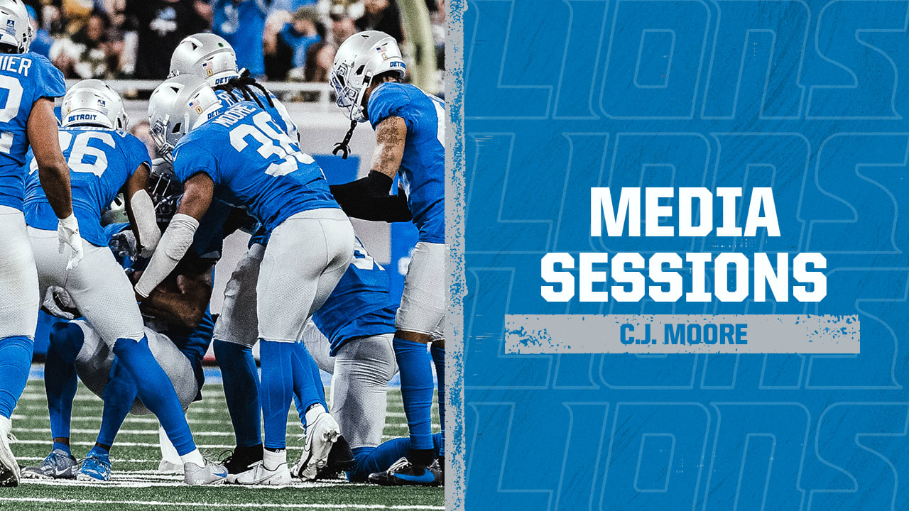 Detroit Lions safety C.J. Moore prays in the end zone before an